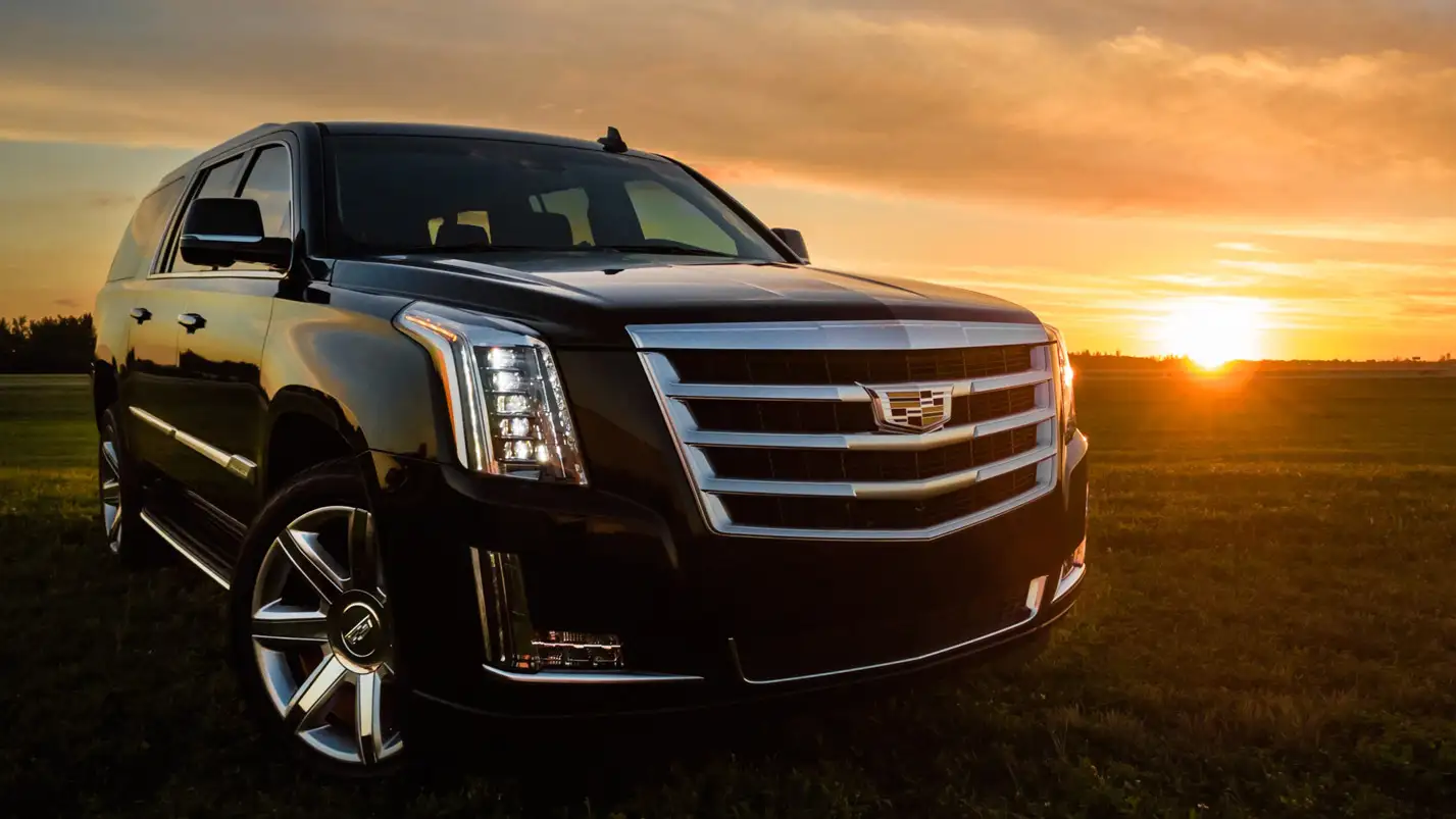 Cadillac Escalade driven by luxury chauffeur