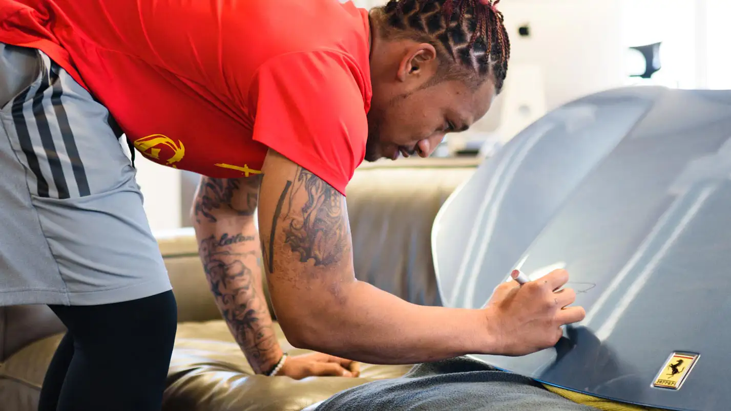 albert wilson signing the ferrari hood mph club