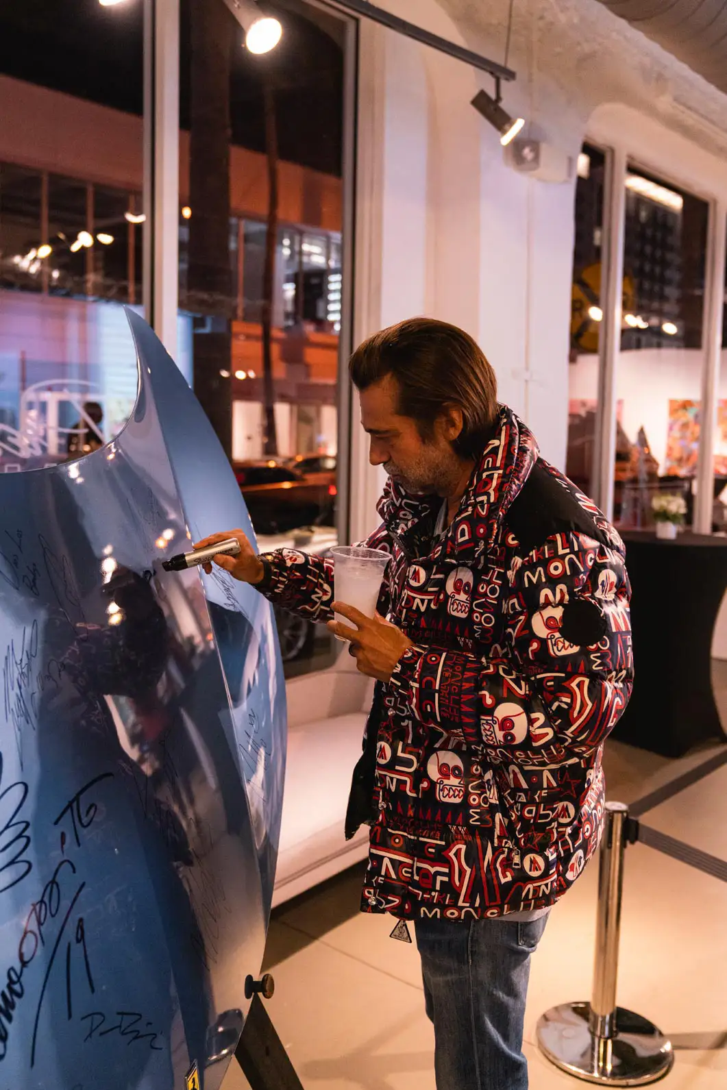jordi molla signing the ferrari hood from mph club