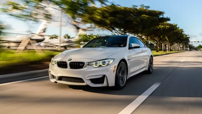 BMW M4 rental driving view mph club
