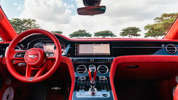 White on red Bentley GT rental Monaco dashboard view mph club