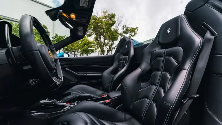 Blue Ferrari 488 Spider rental interior view mph club