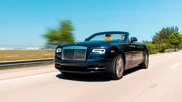 Blue Rolls Royce Dawn rental rolling view mph club