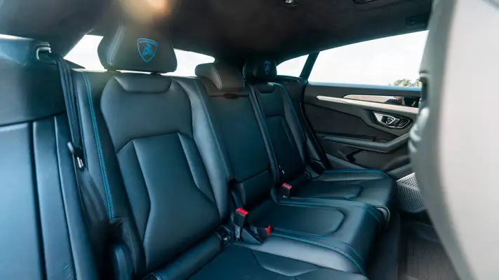 Lite blue Lamborghini Urus rental interior 2 view mph club