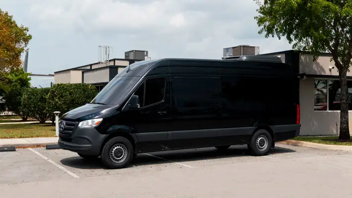 Mercedes Benz Sprinter 15 passenger rental side view mph club