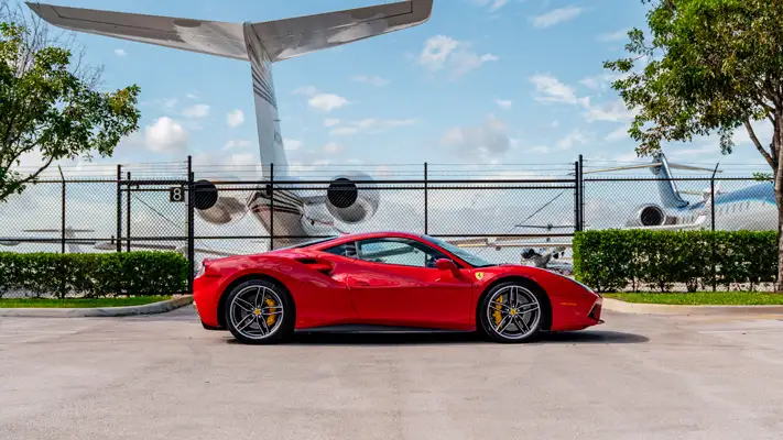 Red Ferrari 488 GTB rental side view mph club