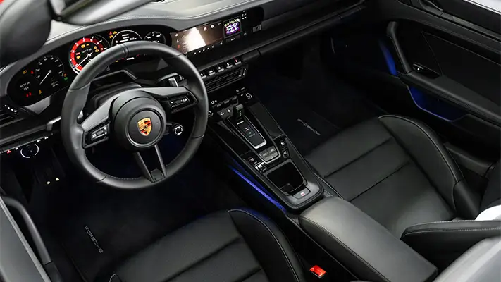 Red Porsche 911 Carrera Cabriolet rental dashboard view mph club
