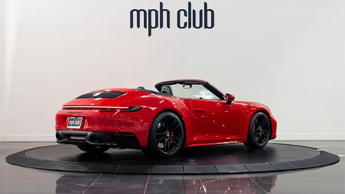 Red Porsche 911 Carrera Cabriolet rental rear view mph club