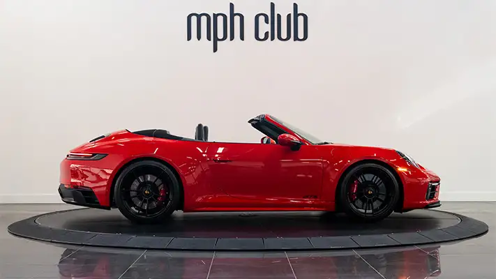 Red Porsche 911 Carrera Cabriolet rental side view mph club