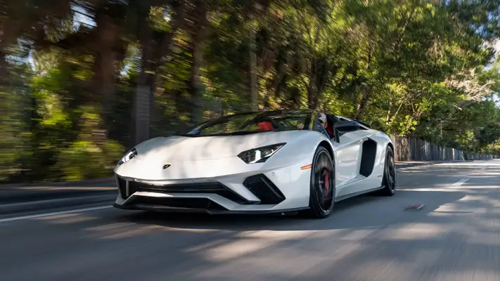 White Lamborghini Aventador S Roadster for rent Monaco rolling view mph club