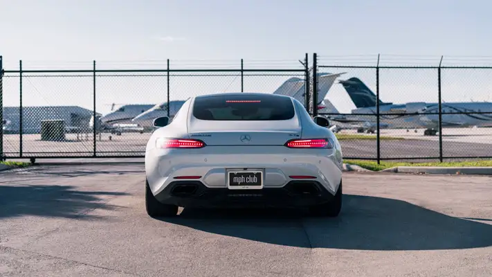 White Mercedes Benz AMG GTS rental rear view mph club