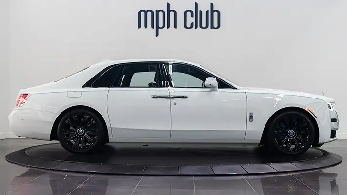 White on blue Rolls Royce Ghost side view rental mph club