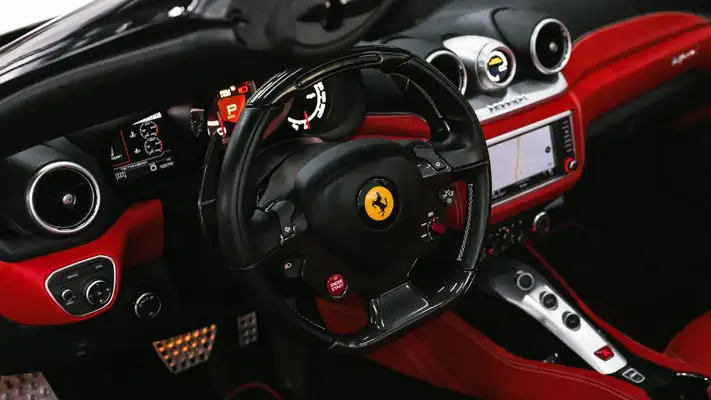 White on red Ferrari California T rental dashboard view mph club