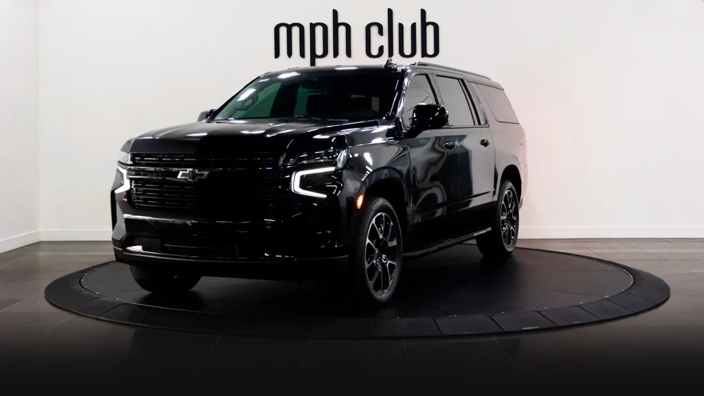 Black on black Chevrolet Suburban rental profile view mph club