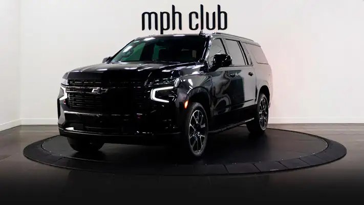Black on black Chevrolet Suburban rental profile view rszd mph club