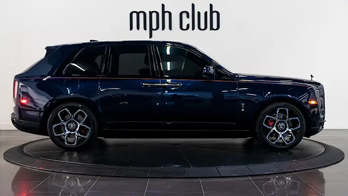 Blue Rolls Royce Cullinan Black Badge rental side view mph club