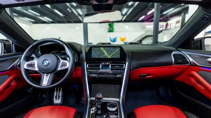 Grey BMW 850I rental dashboard view mph club