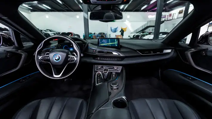 Grey on black BMW I8 rental dashboard view mph club
