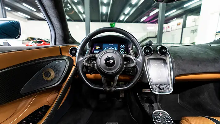 McLaren 570s Spider rental Monaco dashboard view mph club