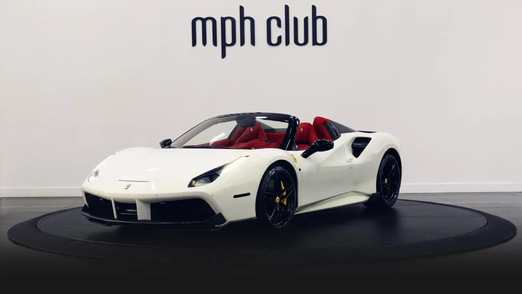 White on red Ferrari 488 Spider for rent profile view mph club