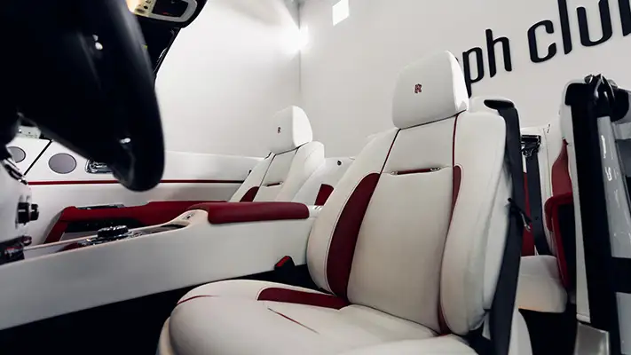 White on white Rolls Royce Dawn rental interior view mph club