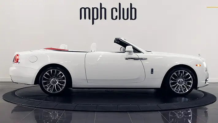 White on white Rolls Royce Dawn rental side view mph club