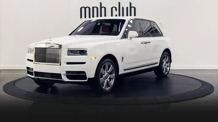 White exterior with orange interior Rolls Royce Cullinan rental profile view rszd mph club