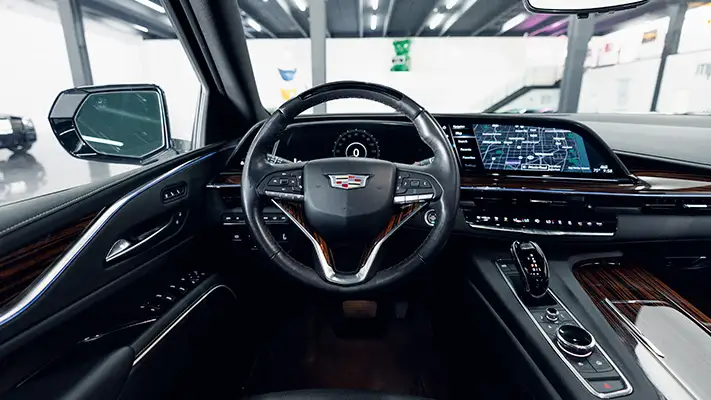 White on black Cadillac Escalade rental dashboard view turntable mph club