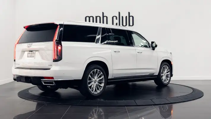 White on black Cadillac Escalade rental rear view turntable mph club
