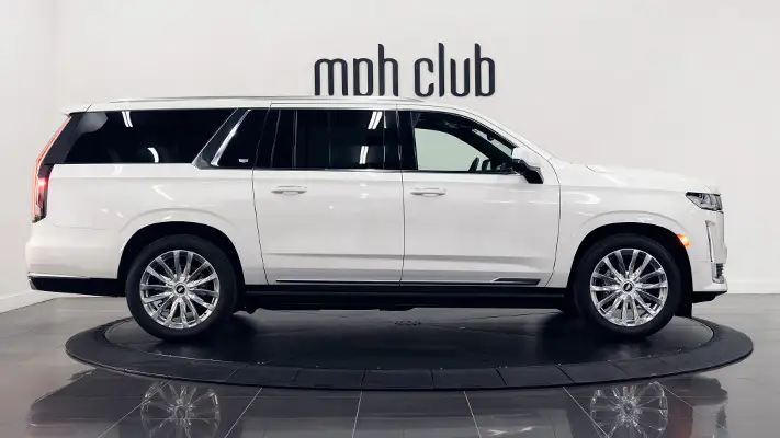 White on black Cadillac Escalade rental side view turntable mph club