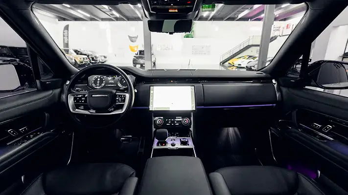 White Range Rover rental Monaco dashboard view mph club