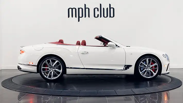 White with red Bentley Continental GTC rental side view mph club