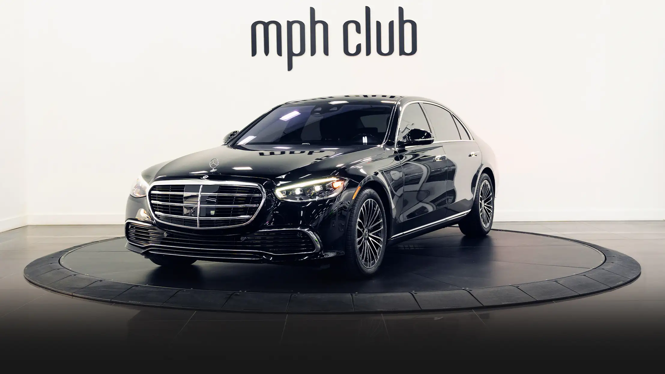 Black Mercedes Benz S Class 580 rental profile view mph club turntable