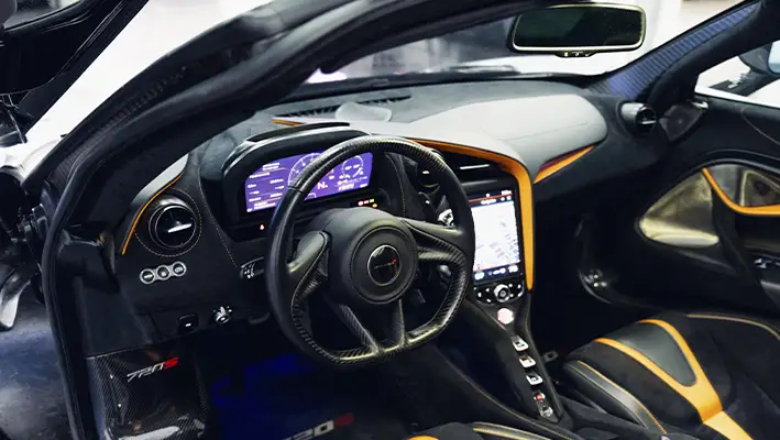 White with orange McLaren 720s rental dashboard view - mph club