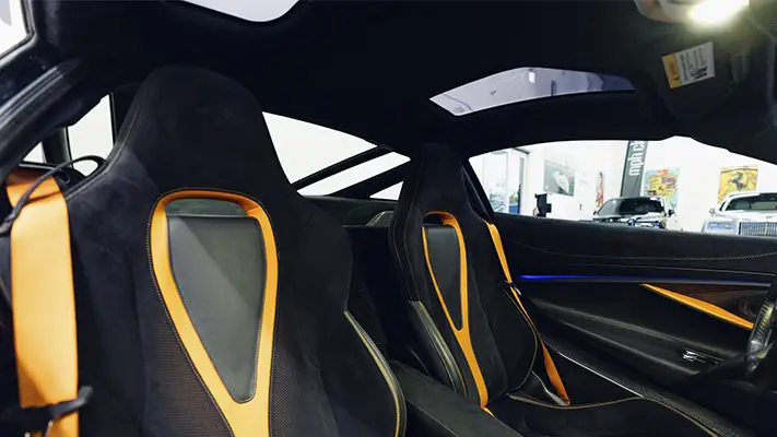 White with orange McLaren 720s rental interior view - mph club