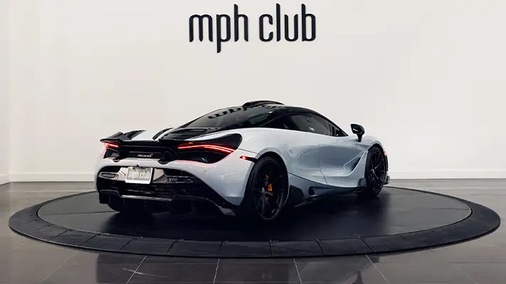 White with orange McLaren 720s rental rear view - mph club