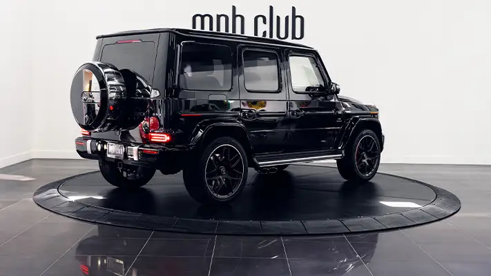 Black with red Mercedes Benz G63 AMG G Wagon rental rear view - mph club