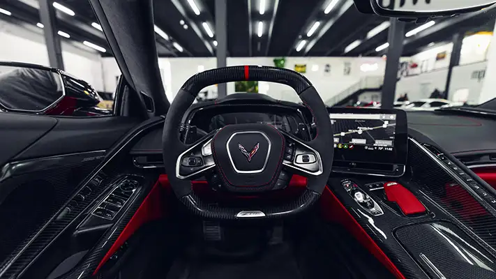 Red Chevrolet Corvette Z06R rental dashboard view - mph club