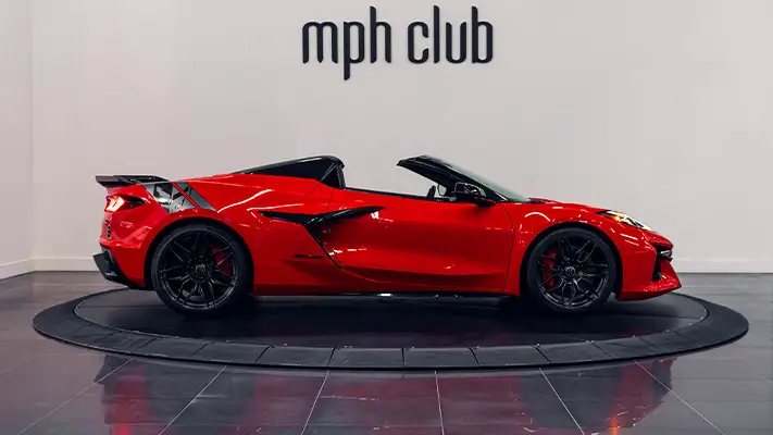Red Chevrolet Corvette Z06R rental side view - mph club