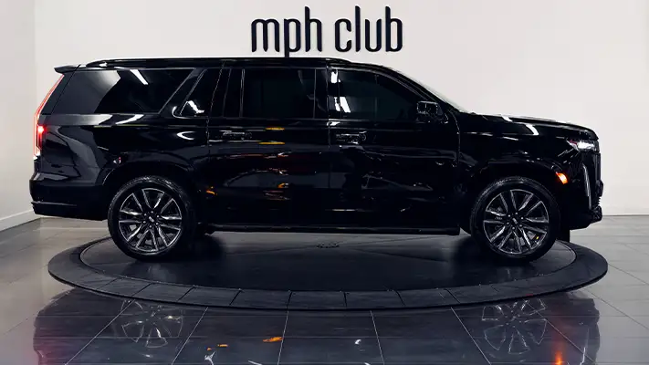 Black on black Cadillac Escalade rental side view turntable - mph club