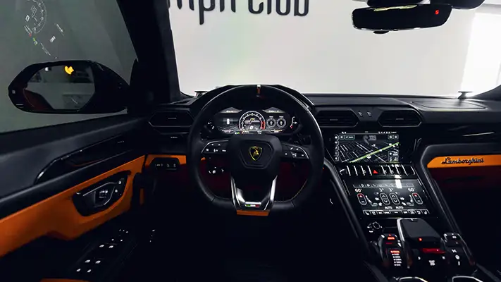 Grey on orange Lamborghini Urus for rent Monaco dashboard view - mph club