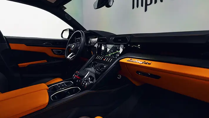 Grey on orange Lamborghini Urus for rent Monaco interior view - mph club