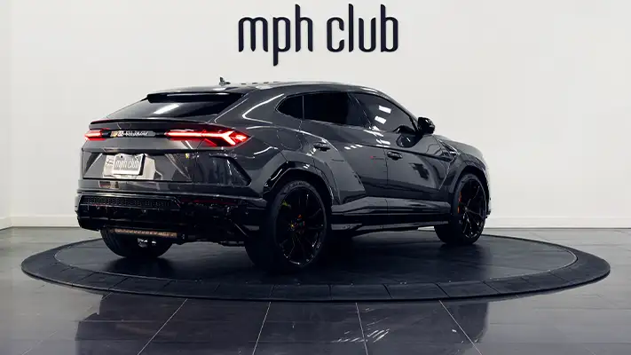 Grey on orange Lamborghini Urus for rent Monaco rear view - mph club