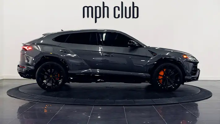 Grey on orange Lamborghini Urus for rent Monaco side view - mph club