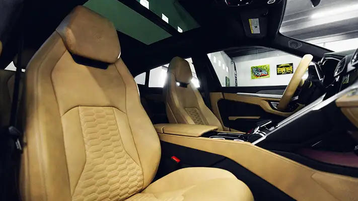Green on brown Lamborghini Urus rental interior view - mph club