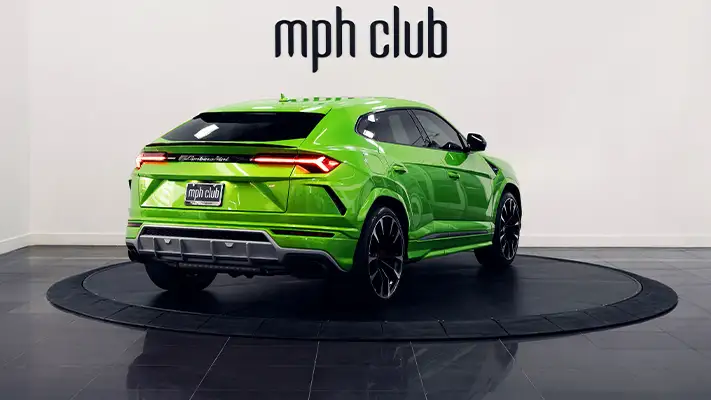 Green on brown Lamborghini Urus rental rear view - mph club