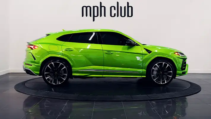 Green on brown Lamborghini Urus rental side view - mph club
