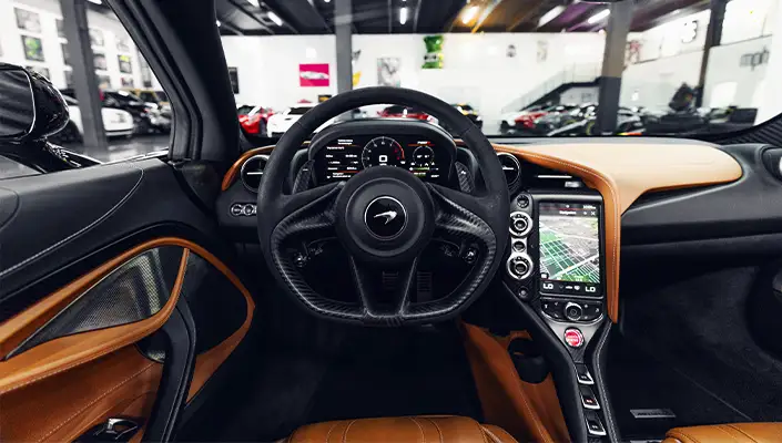 Black McLaren 720s Spider rental dashboard view - mph club