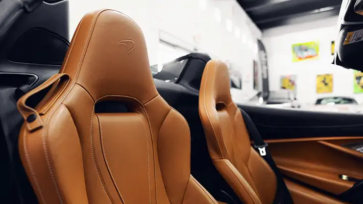 Black McLaren 720s Spider rental interior view - mph club