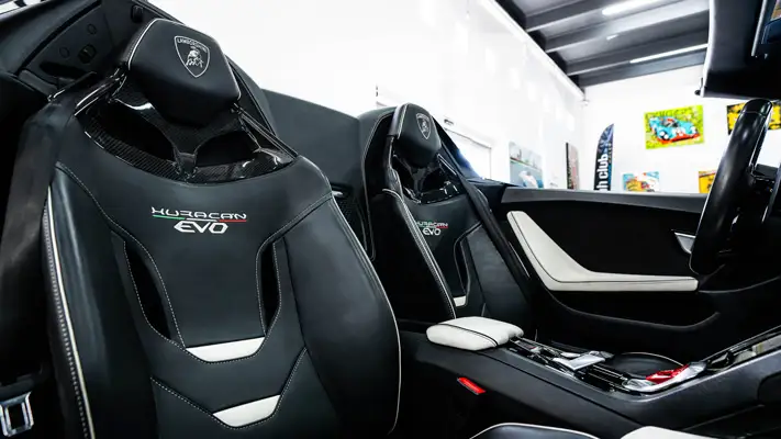 Blue Lamborghini Huracan EVO Spyder rental interior view - mph club